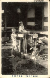 Children at a garden fountain Postcard