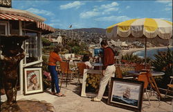 Colorful View of Artists at Work on the Patio of Victor Hugos Laguna Beach, CA Postcard Postcard