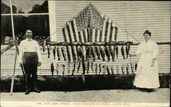 Mr. and Mrs. Perry Pike Fishing in Shell Lake, Wis Postcard