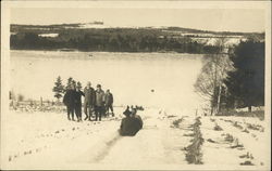 Sledding on Hill Postcard