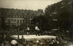 Outdoor scene with boxing ring Postcard Postcard