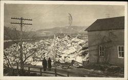 2 people looking at rubble Disasters Postcard Postcard