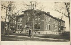 Man walking in front of building Binghamton, NY Postcard Postcard