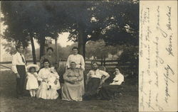 Group portrait, outside under trees Postcard