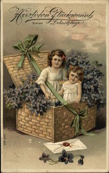 Two Girls In Basket With Flowers Postcard