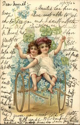 Two Children Riding Cart of Flowers Postcard Postcard