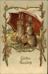 Easter Greeting - Two Brown Bunnies Under Large Umbrella Carrying Eggs in Baskets With Bunnies Postcard Postcard