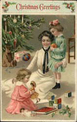 Christmas Greetings with Mother and Children by the Tree Postcard Postcard