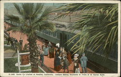 Santa Fe Limited at Needles, California, Indians Selling Beadwork in Front of El Garces Hotel Postcard Postcard