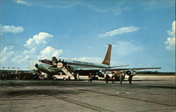 Passengers alighting from plane arriving at General William Mitchell Air Terminal Postcard