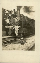 Three Men by Locomotive Locomotives Postcard Postcard