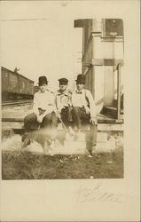 Men on Railroad Platform Postcard