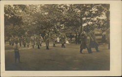 Uniformed men in a street parade in 1909 West Chester, PA Postcard Postcard