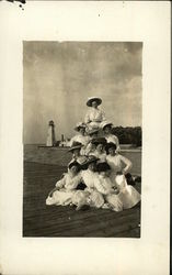 Women in White, in Front of Light House Postcard