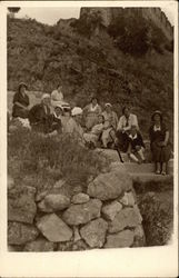 Walkers rest on a hillside stairway Postcard