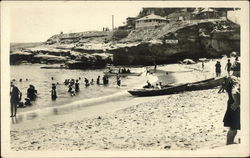 At the beach in the early 20th century Postcard