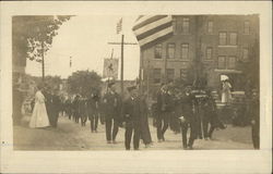 Bagpipe troop in an early 20th century parade Postcard