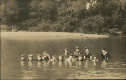 Photograph of people swimming in a river in the early 20th century Postcard