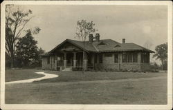 Photograph of a brick house in the early 20th century Warren, OH Postcard Postcard