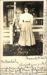 Woman Standing in Front of House Fremont, OH Postcard Postcard