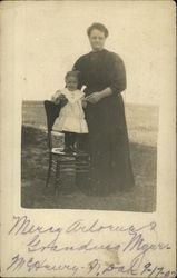 Woman & girl on chair - McHenry, ND Postcard