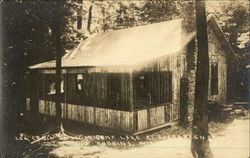 Log cabin on Sugarcamp Lake at Evergreen Road Postcard