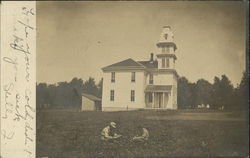 Children sitting in a meadow next to a church Churches Postcard Postcard