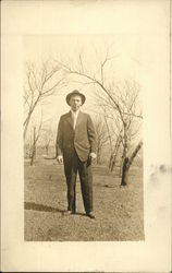 Man Standing in an Orchard Men Postcard Postcard