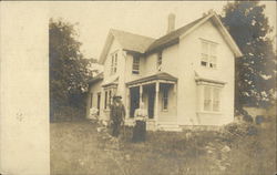 Family In Front of Home Marion, MI Postcard Postcard