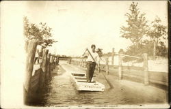 Poling a flatboat between lakes Twin Lake, MI Postcard Postcard