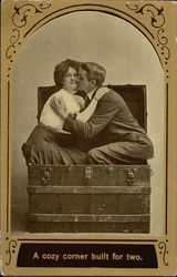 Woman and Man Kissing while Sitting in a Traveling Trunk Couples Postcard Postcard Postcard