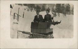 Man and Woman on a Sled in the Snow Couples Postcard Postcard Postcard