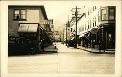 View of Front Street Showing Hotel Revilla Postcard