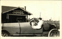 Two Women in an Early Roadster Automobile Postcard