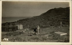 Man at a Cross in a Graveyard by Ocean California Postcard Postcard Postcard