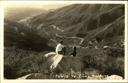 Man and Woman on Rock Along the Palms To Pines Highway Postcard