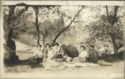 People Picnicking on a River Bank Postcard