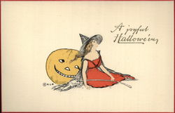 Witch Dressed in Red Leaning Against Jack O'Lantern Halloween Postcard Postcard Postcard