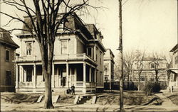 Person and Dog in front of Townhouse Buildings Postcard Postcard Postcard