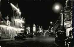 Nighttime Street Scene with Classic Cars Postcard