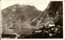 Boat in the Water surrounded by Mountains Postcard