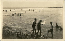 People Playing in the Ocean Water Postcard