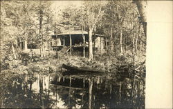 Cabin in the Woods with a Pond and Boat Camping Postcard Postcard Postcard