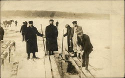 Men Cutting Ice on a Lake Postcard