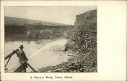 A Giant At Work Nome, AK Postcard Postcard Postcard