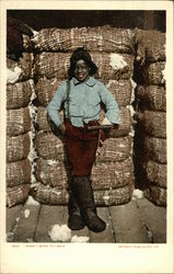 Black Youth standing in front of Cotton Bales Postcard