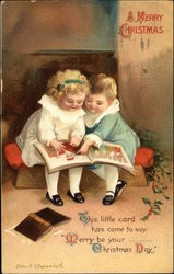 Two Children Reading a Book on Christmas Postcard