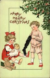 Two Children Opening Stockings on Christmas Postcard