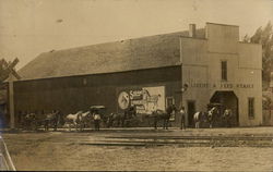 Livery and Feed Stable Showing Horse-Drawn Buggies Postcard