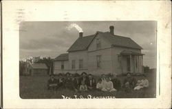 Reverend Gunnerson Family and House Postcard